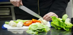 beautiful young chef woman prepare and decorating tasty food in kitchen